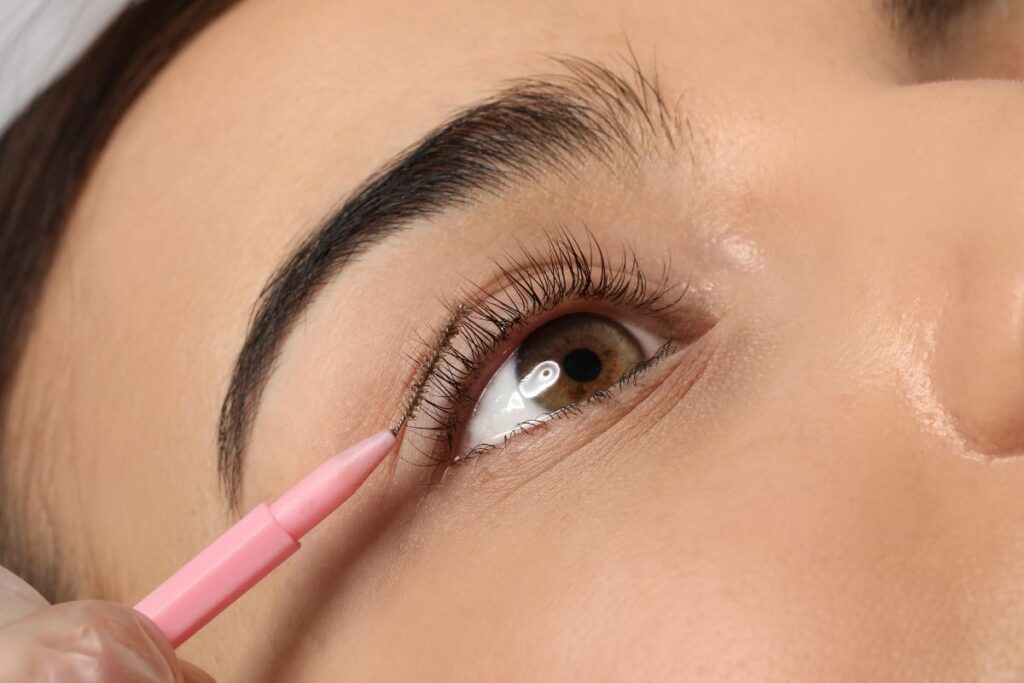 woman with lash lift and mascara wand