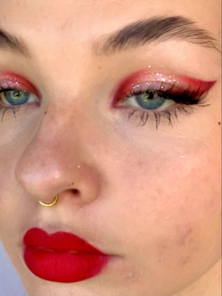 red makeup with glitter