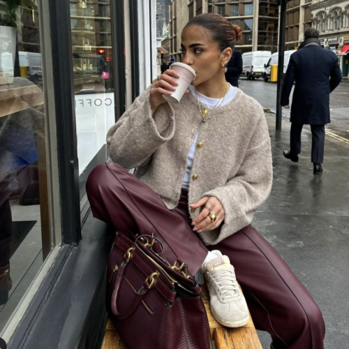 young woman on gloomy day sipping coffee