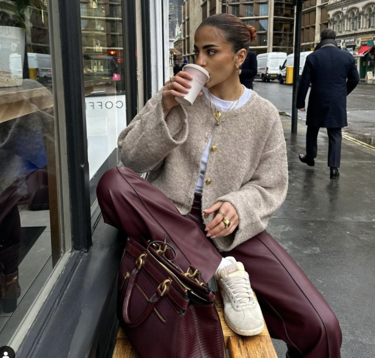 young woman on gloomy day sipping coffee