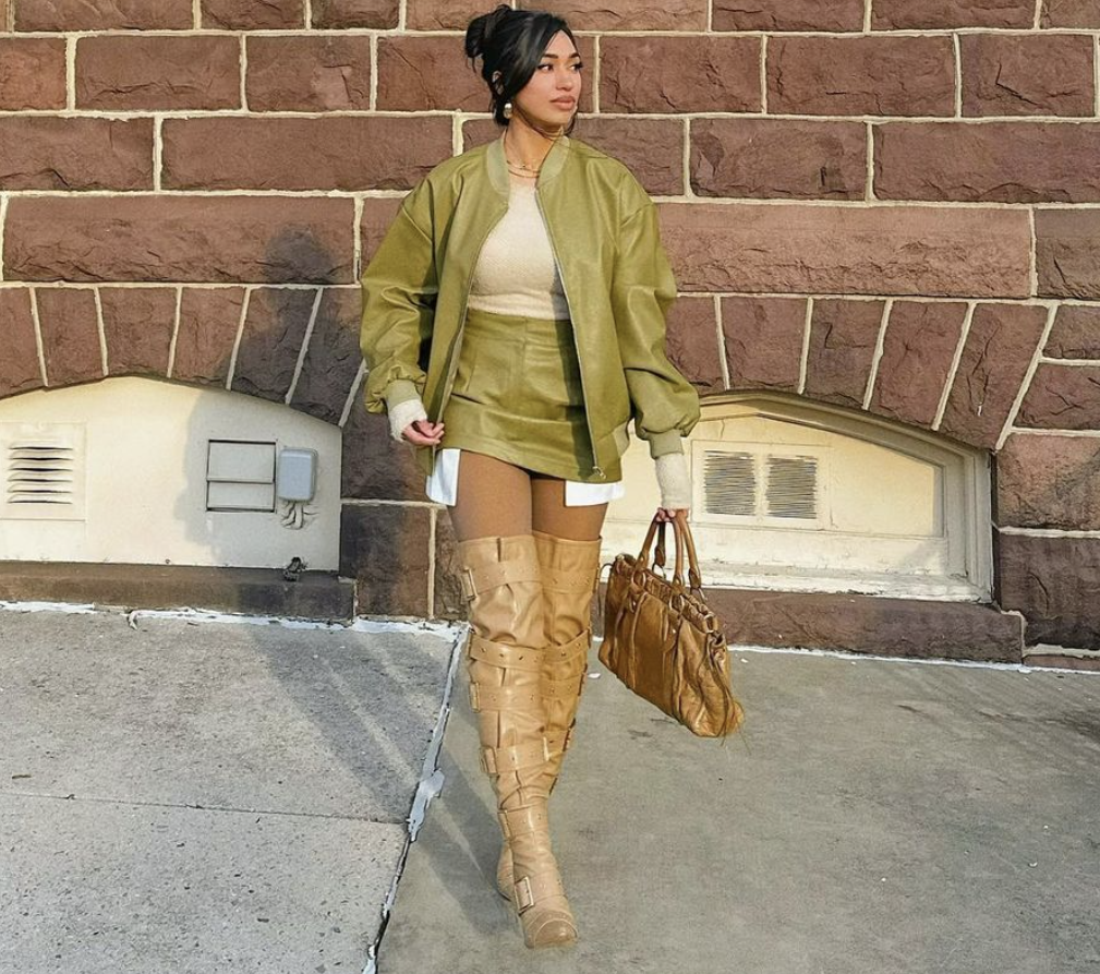 young woman wearing olive green jacket and skirt for fall