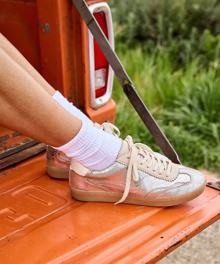 silver sneakers with white socks