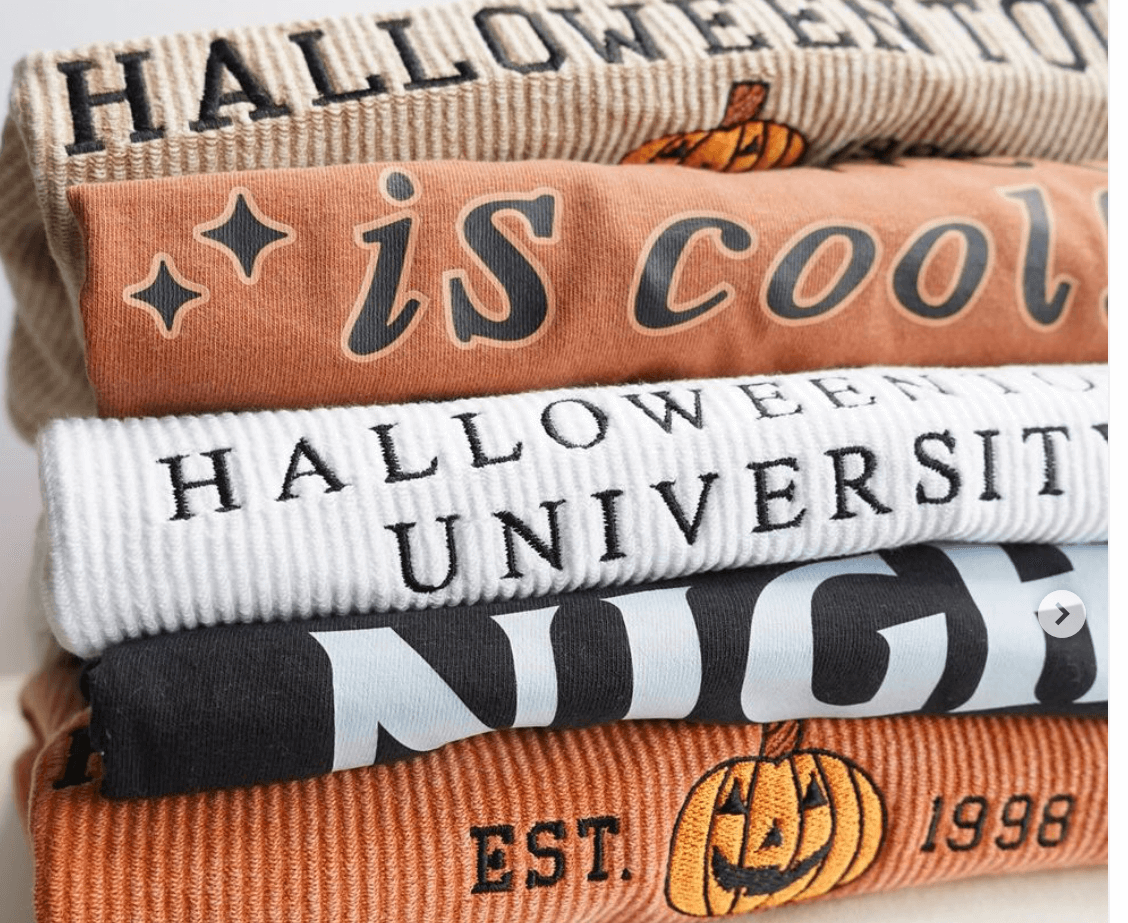 Halloween theme shirts and sweatshirts stacked up