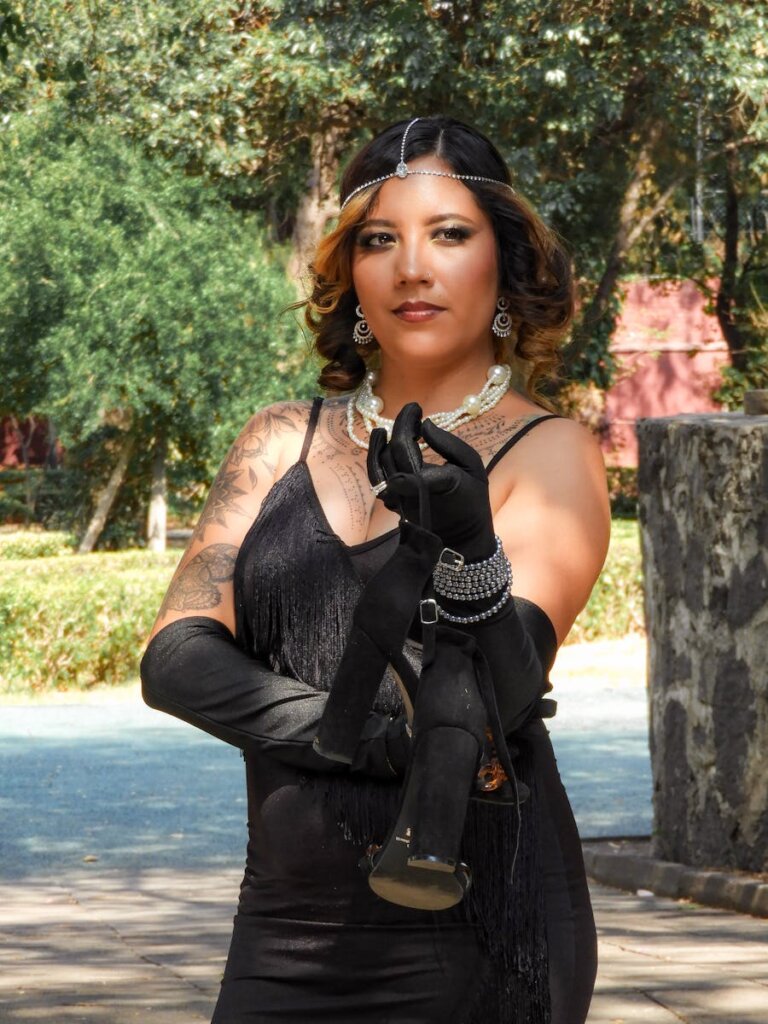 Portrait of a Woman Dressed in 1920s Style Black Dress And Gloves