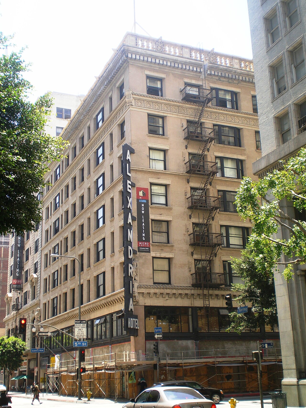 Alexandria Hotel building with trees in foreground 