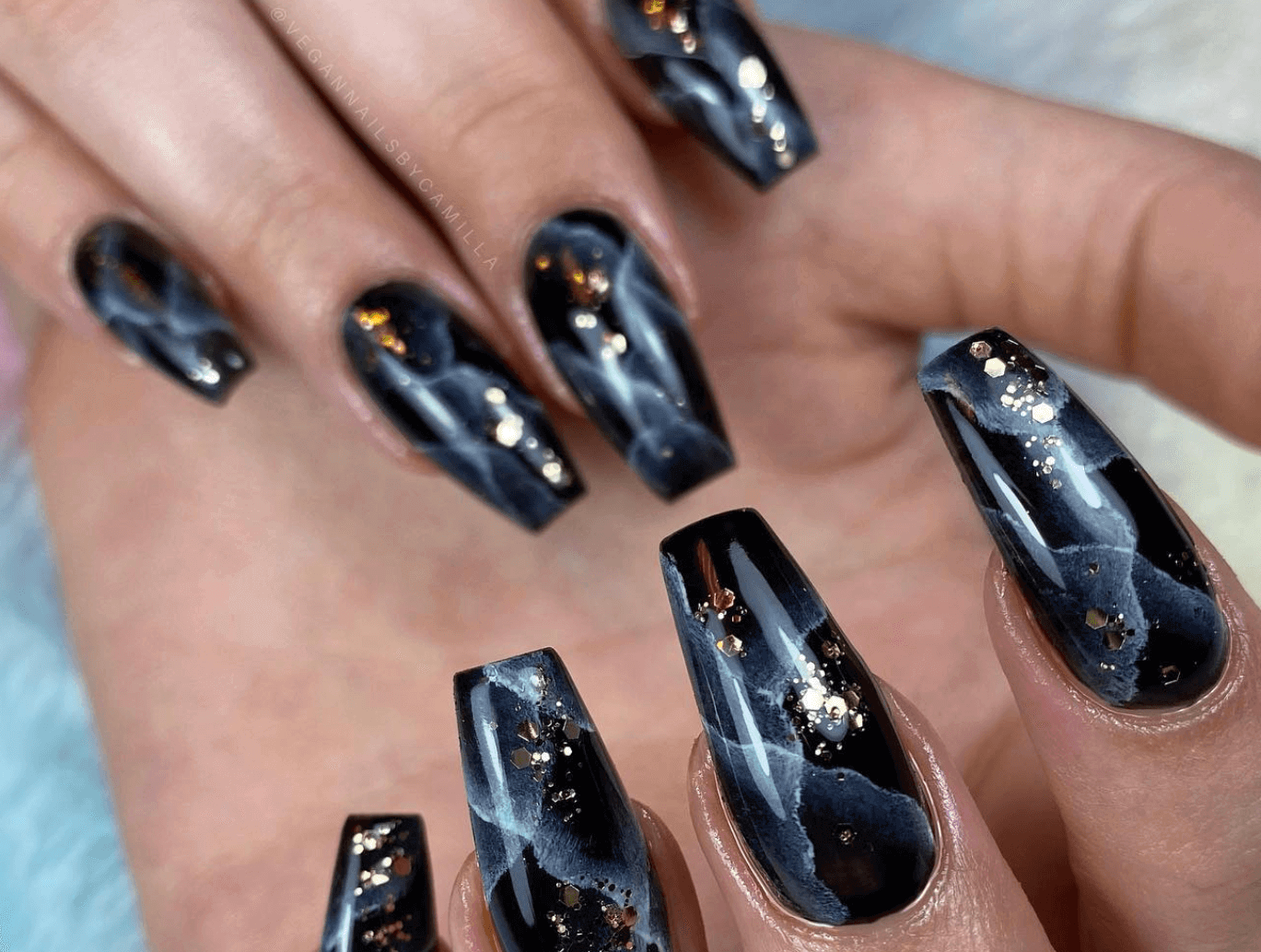 black and gold elegant Halloween nail marble design