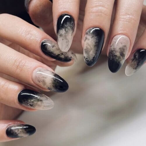 Elegant Halloween nails featuring minimalist marbled design