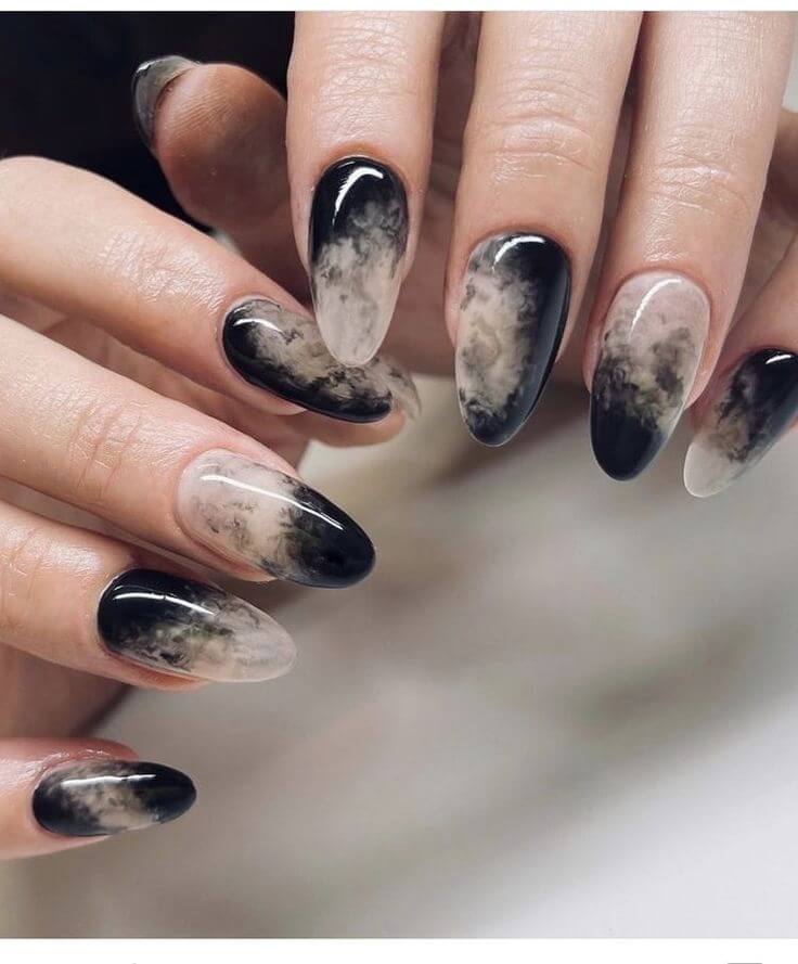 Elegant Halloween nails featuring minimalist marbled design