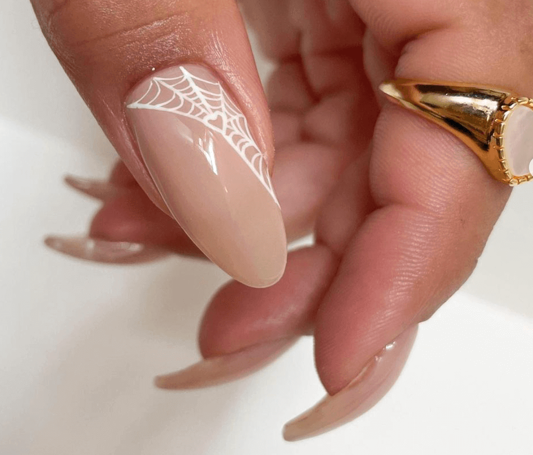 elegant Halloween nails featuring white web design