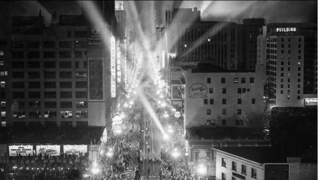 black and white photo of Broadway street in DTLA with spotlights coming from street