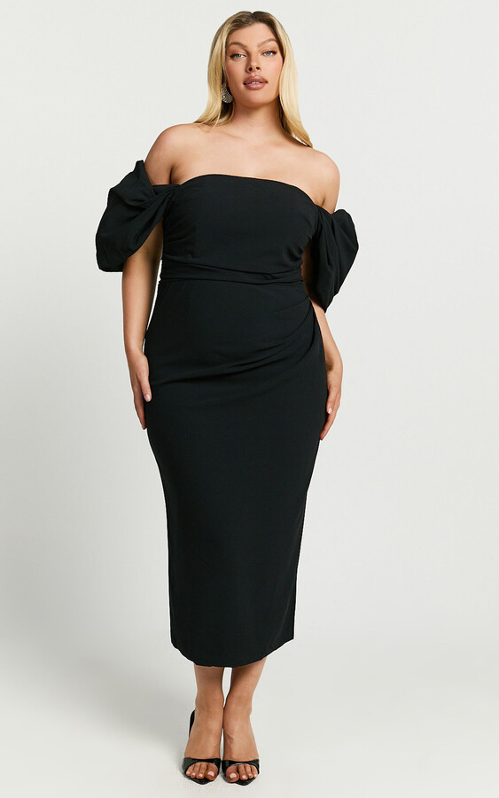 blonde model wearing black strapless midi dress with puff draped sleeves