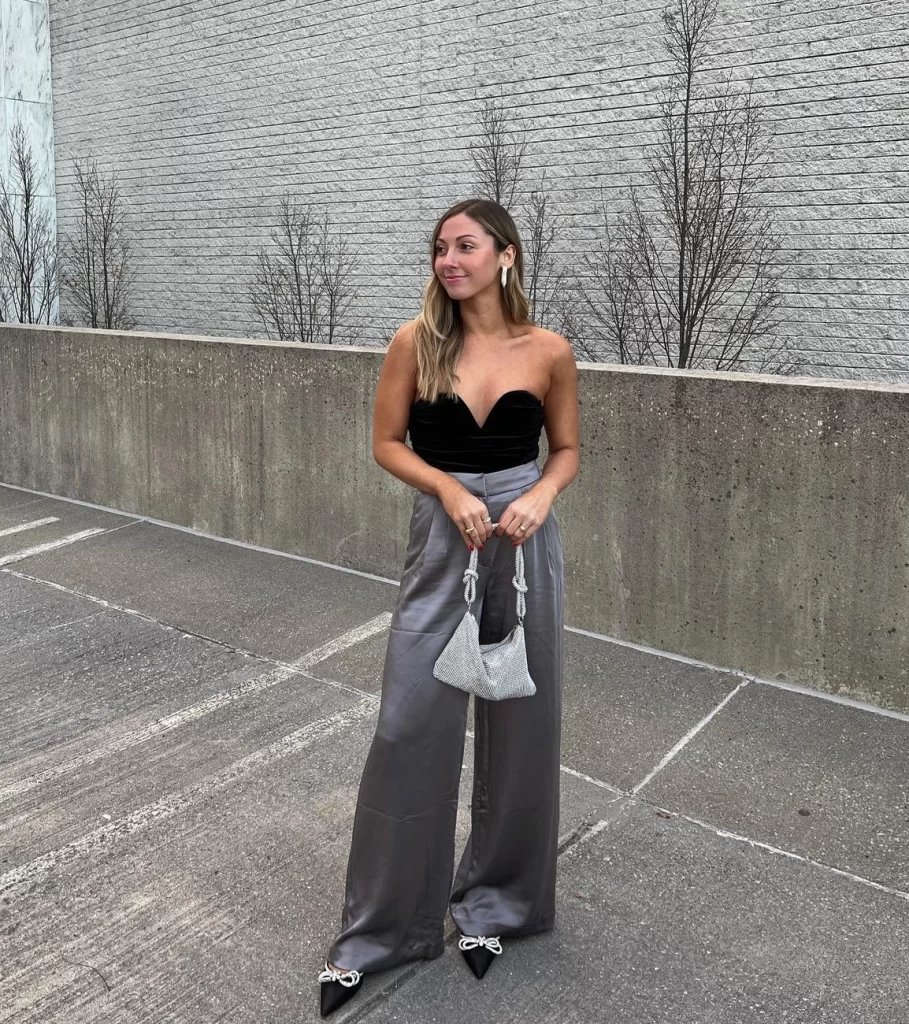 Office Christmas party outfit with grey satin pants and strapless velvet top