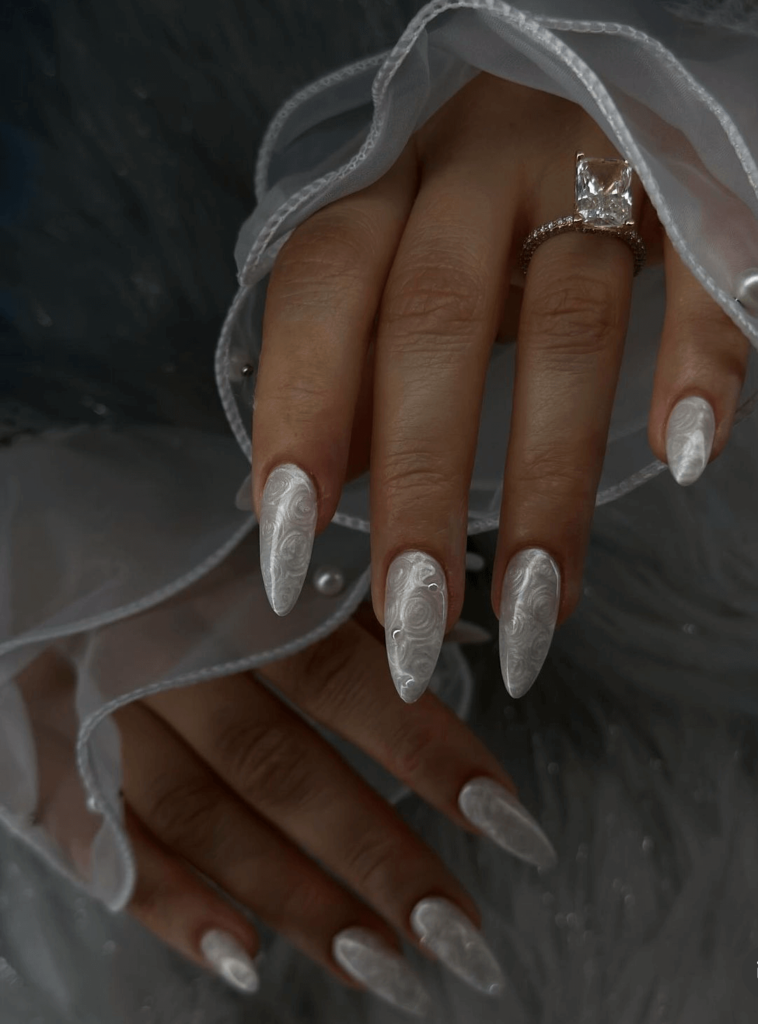 swirly white nail design for winter