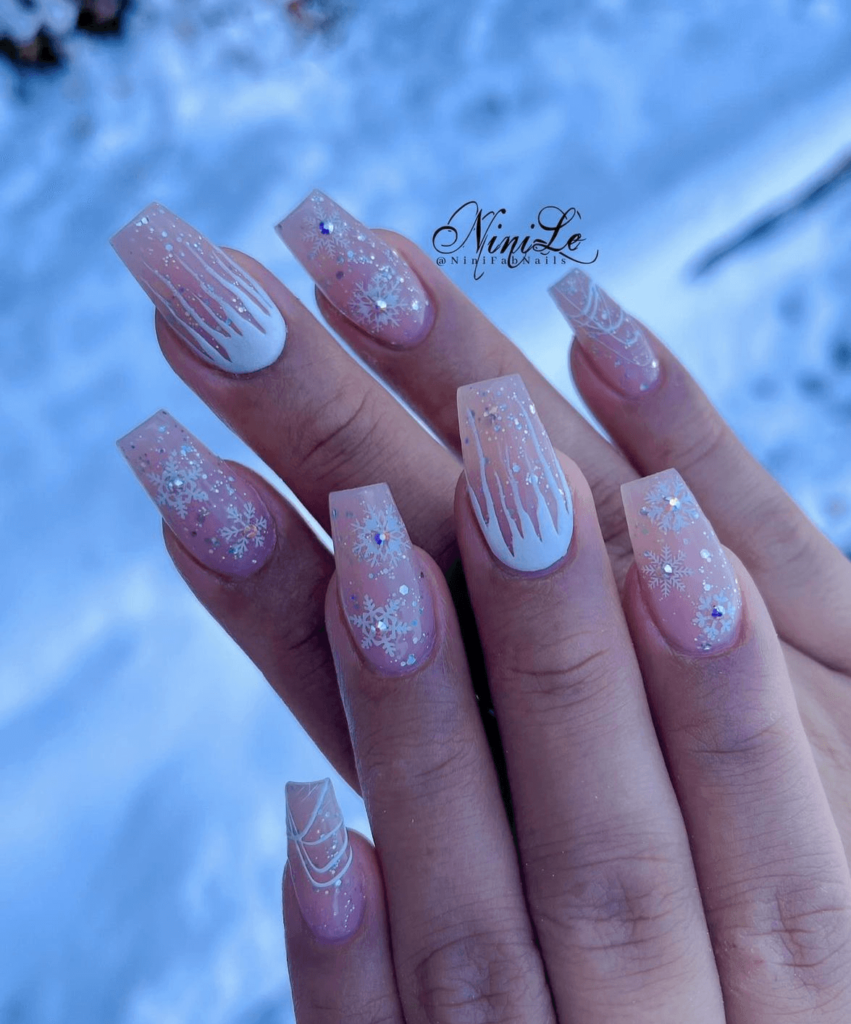 white winter nail art with ice drippings and snowflakes