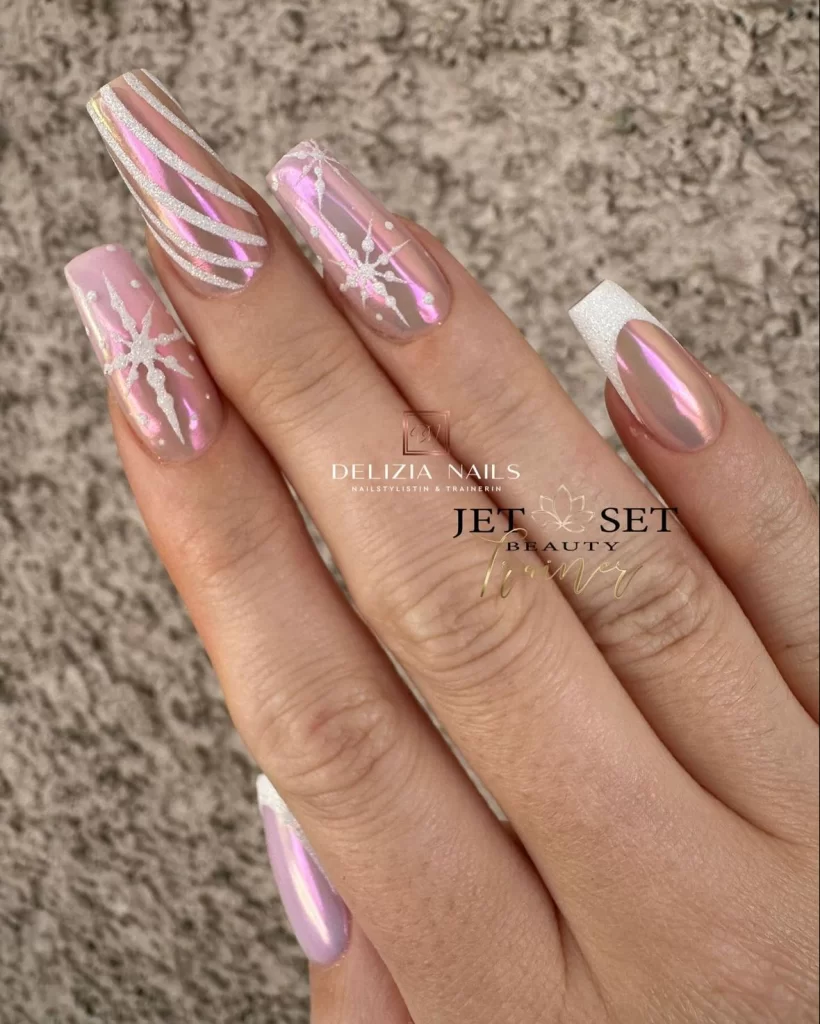 pink chrome nails with winter nail designs in white glitter