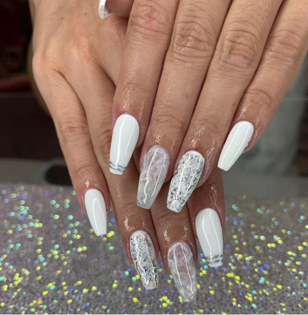 white manicure with glitter swirl accents