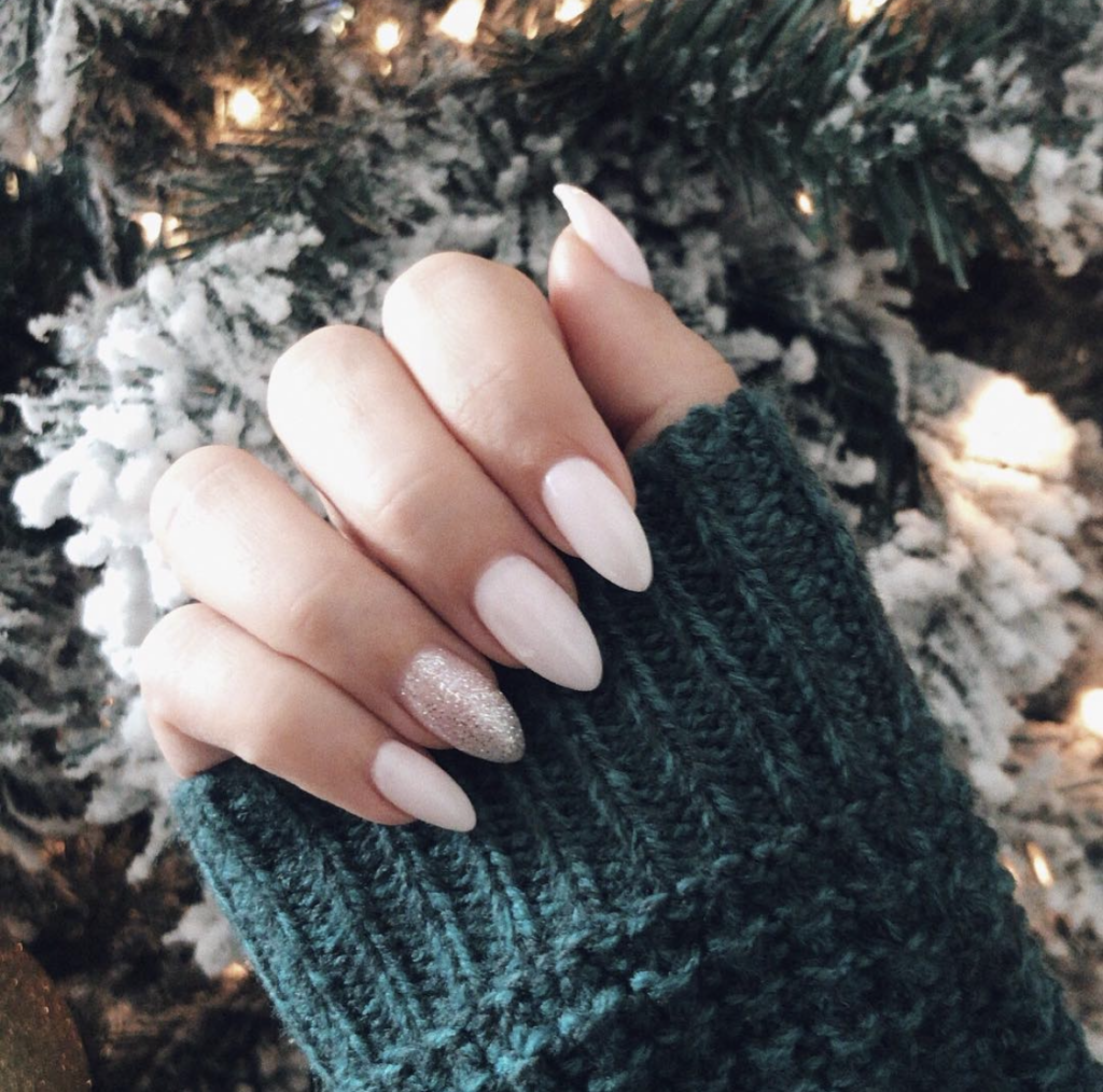 white holiday nails with glitter accent nail