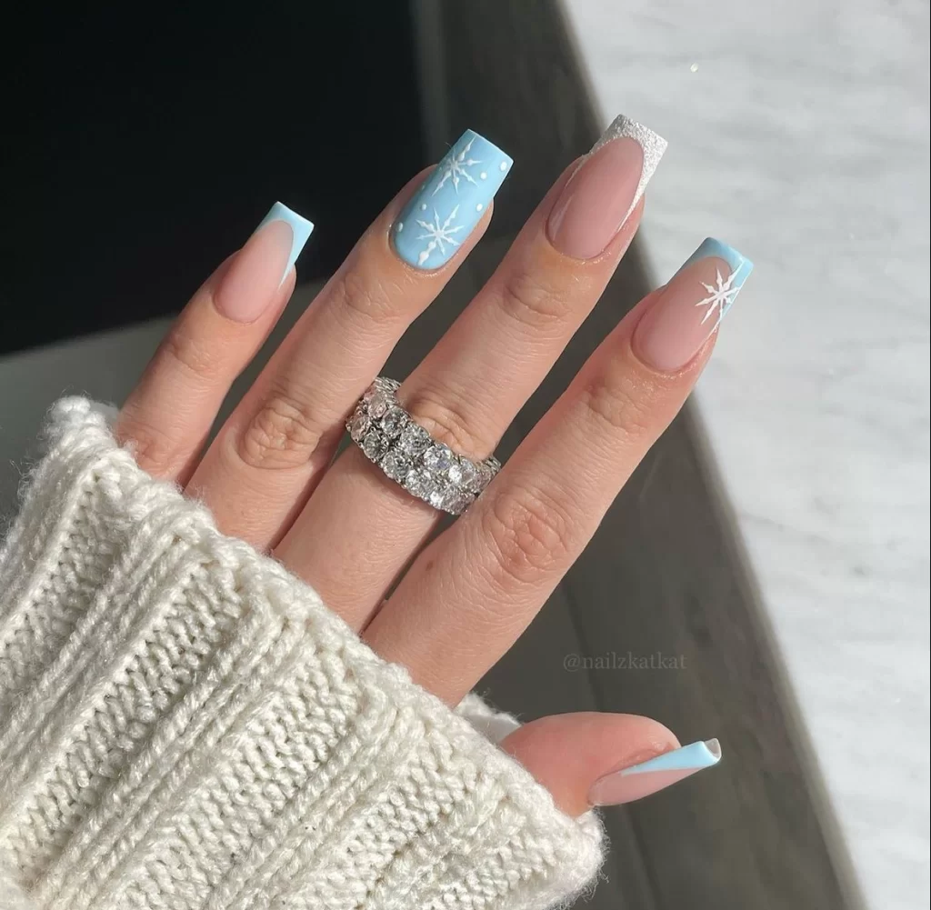 light blue accent nail on french tip nail design