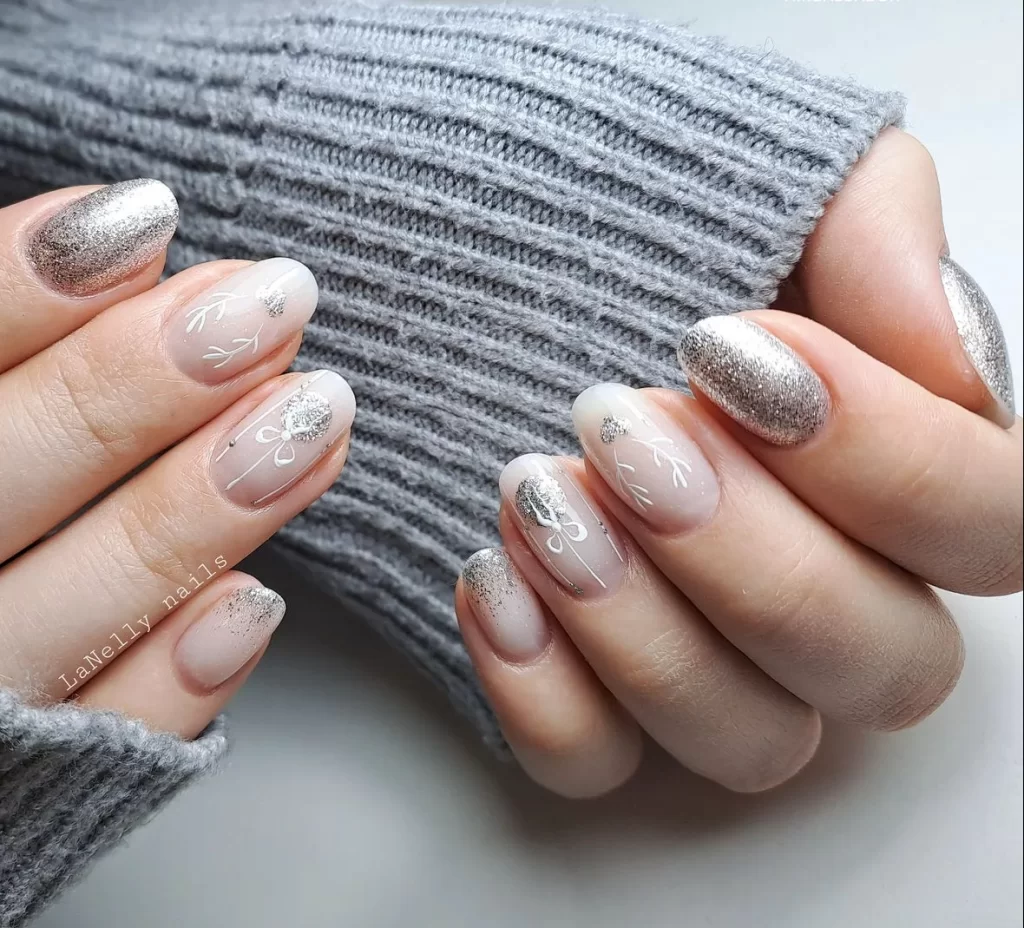 winter nail art design with silver ribbons and silver ornaments