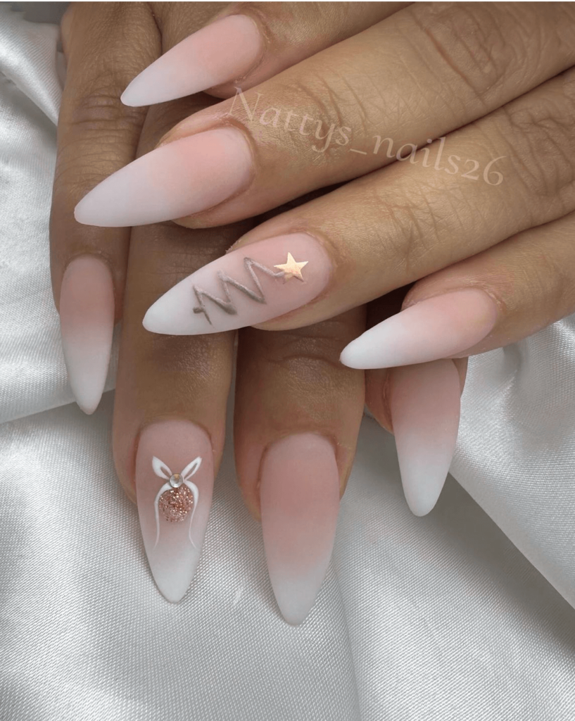 minimalist christmas tree nail art with white and nude tones