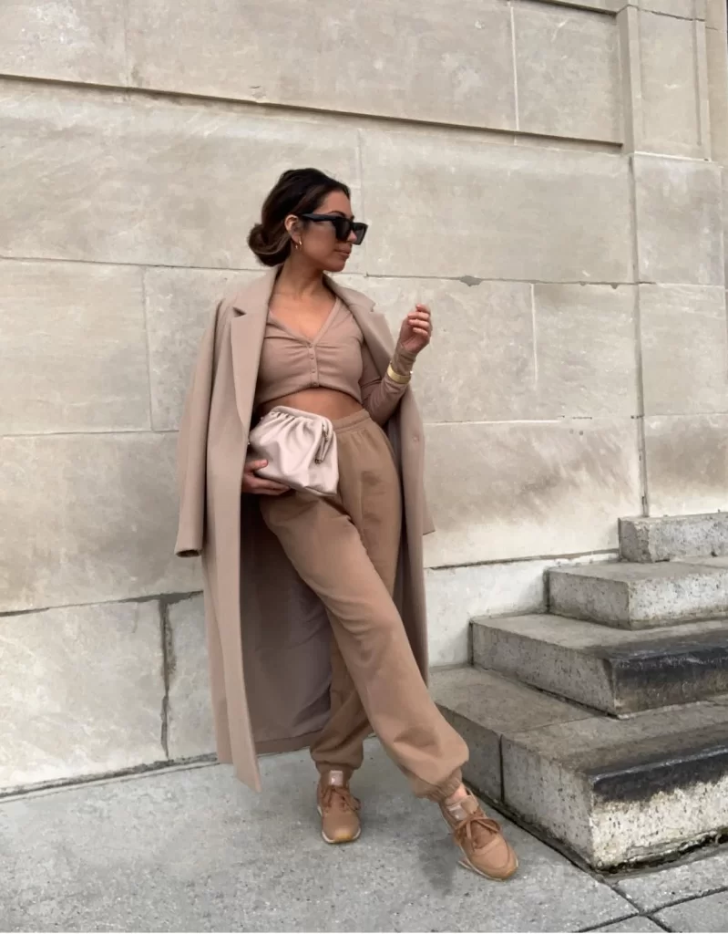 young woman wearing neutral brown baddie sweatpants outfit