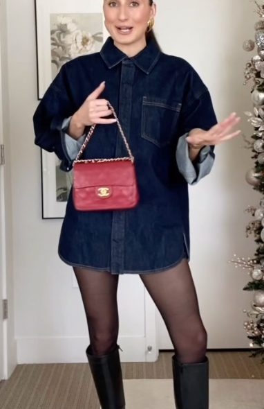 Young influencer showing her denim on denim outfit with tights and knee high boots