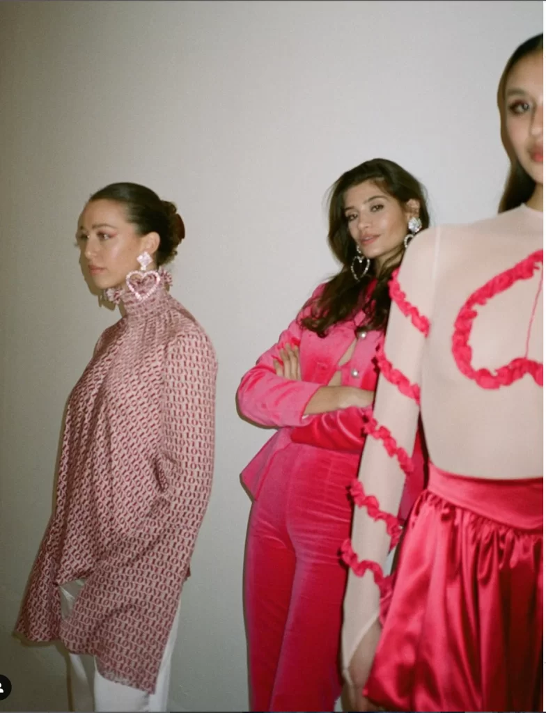 three models standing near wearing all pink winter Valentine's day looks for a Valentines day outfit winter edit