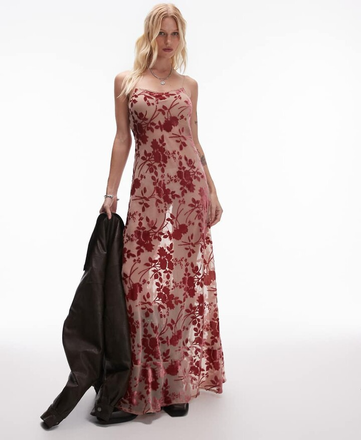 model wearing sheer maxi dress with red floral velvet appliques for a Valentines day outfit winter dress option