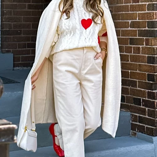 young woman wearing white theme Valentine's day outfit with red shoes