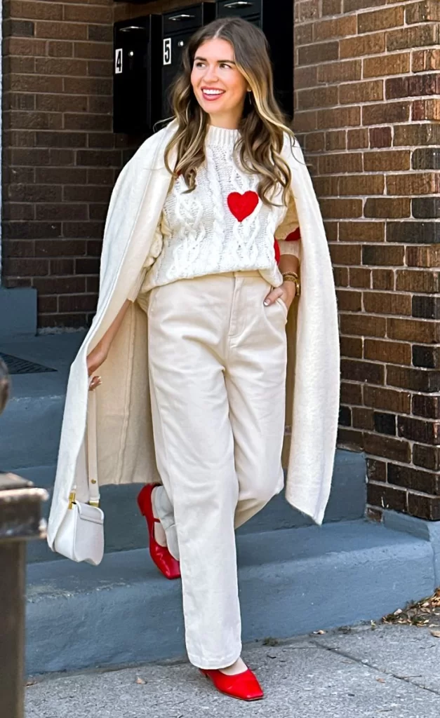 young woman wearing white theme Valentine's day outfit with red shoes. Valentines day outfit winter style white and red.