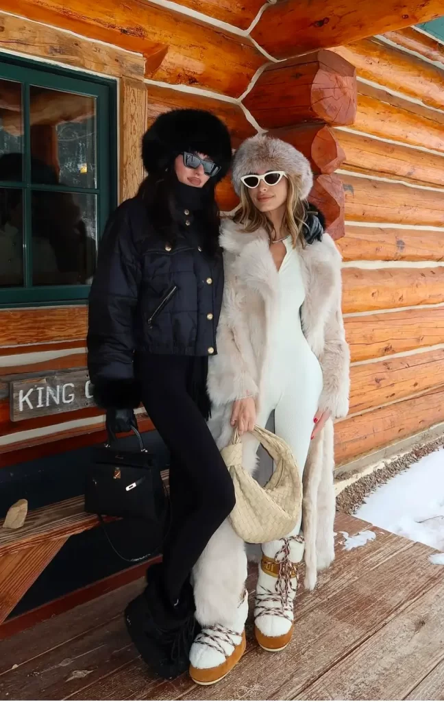 two women in apres ski style outfits black and white