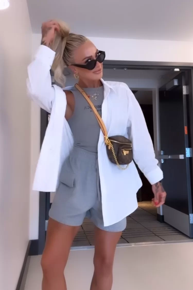 Woman's Amusement Park Outfit picture inspiration with grey knit shorts, grey tank and white button up