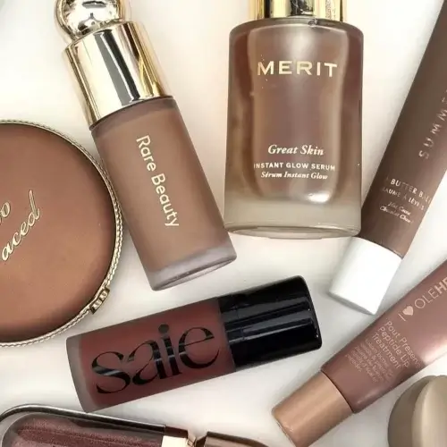 Overhead shot of different makeup bronzers laid out on table top