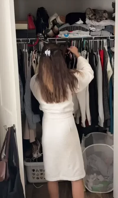 young girl looking into closet to find the perfect summer date night outfit