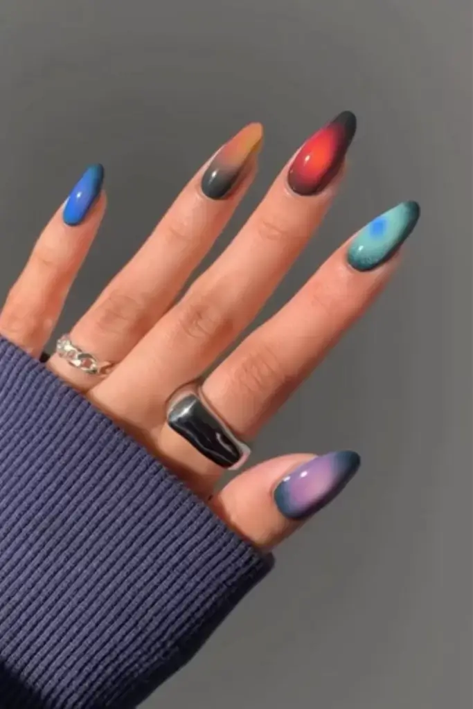 dark fall aura nail design with multiple different shades on each finger 