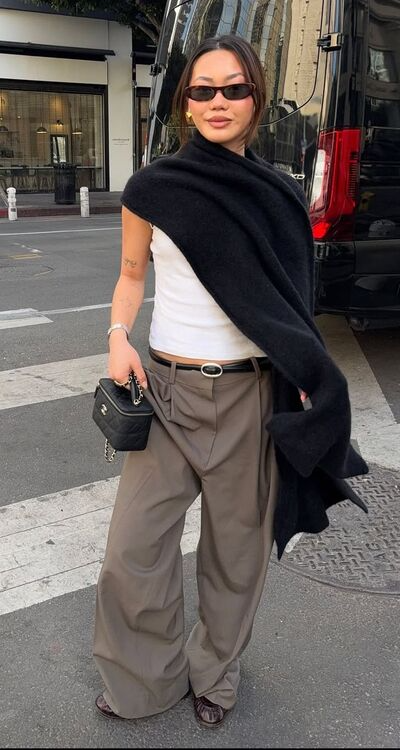 Fall outfit inspiration casual with white tank and relaxed fit jeans paired with trendy poncho