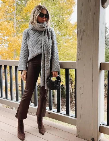 cold weather Thanksgiving outfit with brown denim flare jeans and brown suede heeled boots