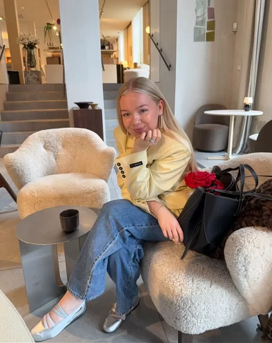 young blonde woman wearing the new ballet inspired sneakers from Puma in a silver metallic finish worn with an easy casual jean outfit