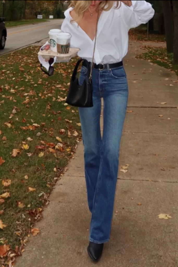 blonde woman wearing Classic straight-leg jeans paired with sleek black pointed boots, the best casual shoes for jeans in winter 2025