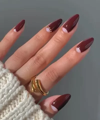 reverse french tip nail design done with a dark burgundy Fall shade