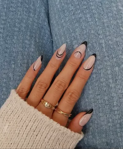 minimalist and subtle Fall nail art on a neutral tone base and delicate black strokes