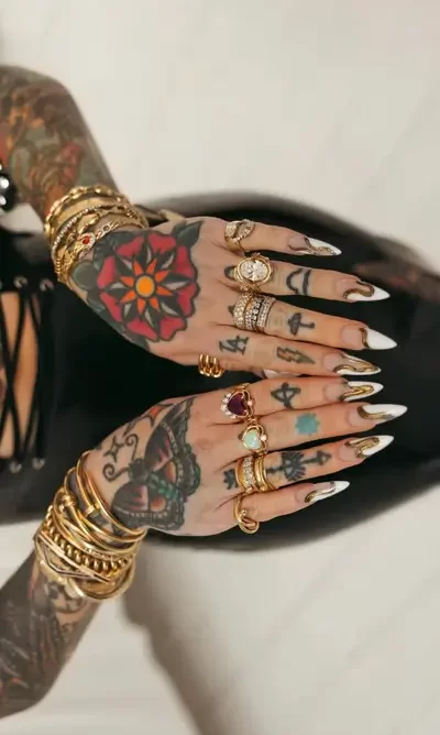 Modern melted french tip nail art with metallic gold accents