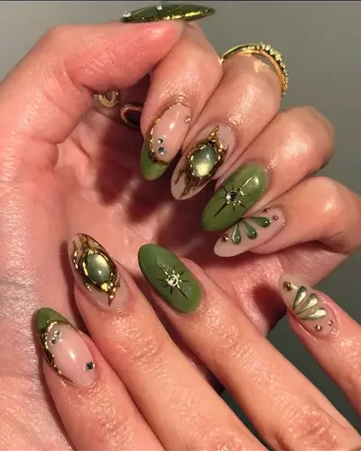 bold, 3-d maximalist green nail art with jewel accents