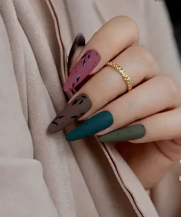close up of woman's Fall manicure with long coffin nails showing different matte finish jewel tone shades