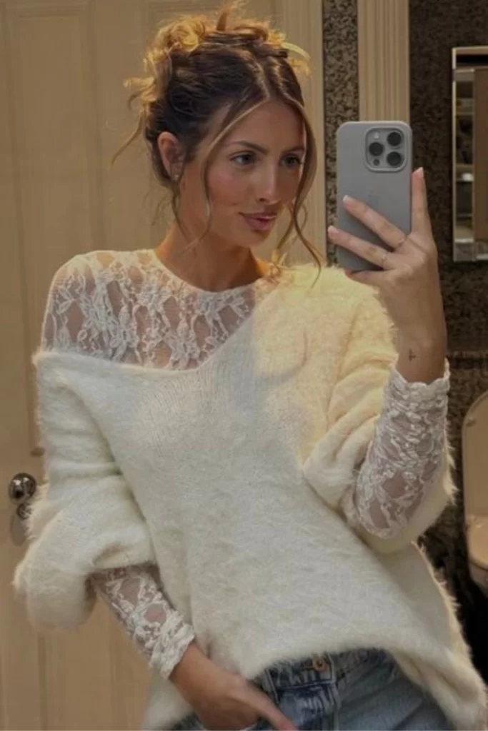 chic and modern fall boho outfit idea of long sleeve lace top layered under oversized knit sweater