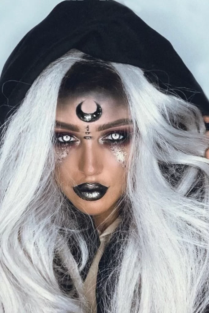 Dark mystic/fortune teller inspired Halloween makeup on young woman