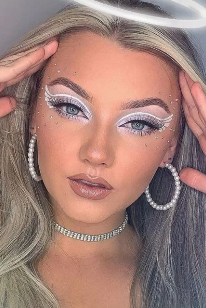 Close up of Angel inspired Halloween makeup with white wings eyeliner