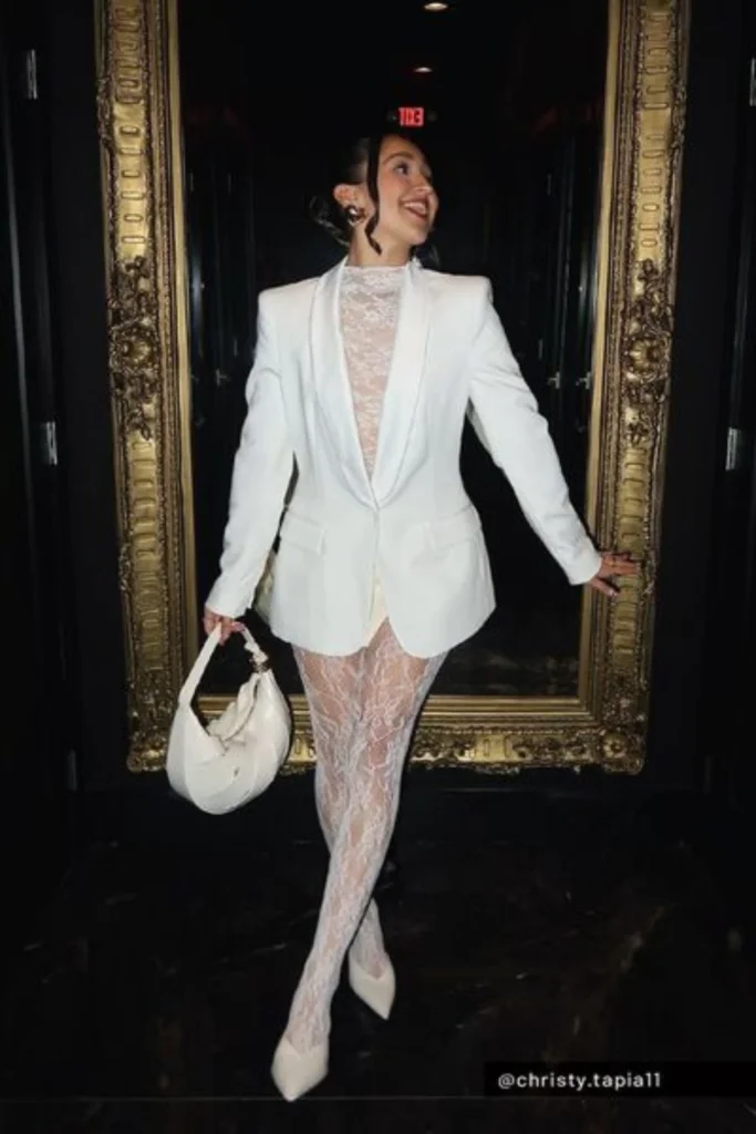 Influence at party wearing all white lace outfit